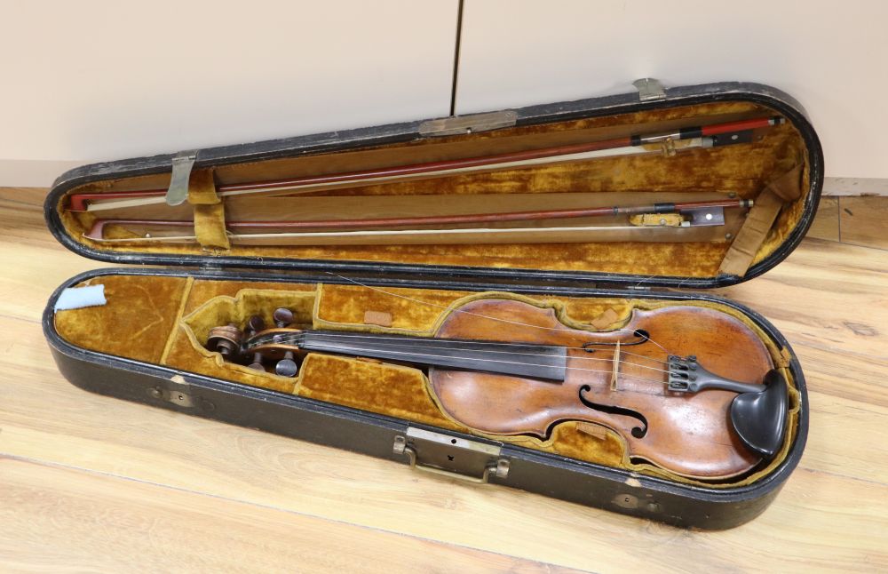 A cased violin with two bows. Violin bears the label Carl Willhelm Claesel, circa late 18th century/early 19th century, 35.5cm back in